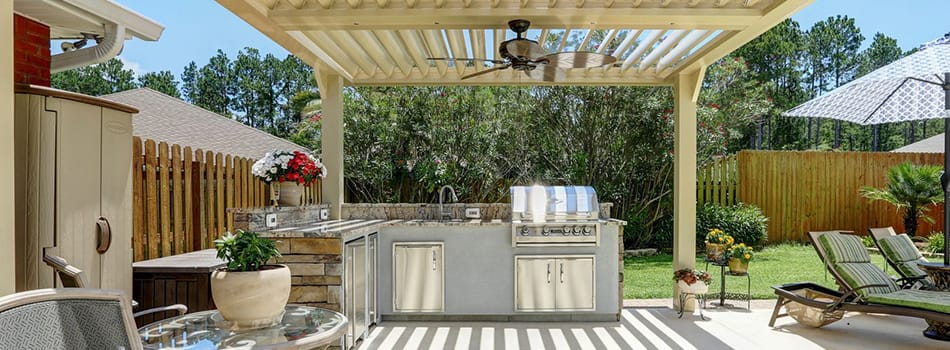Multi-level deck with pergola and outdoor kitchen setup