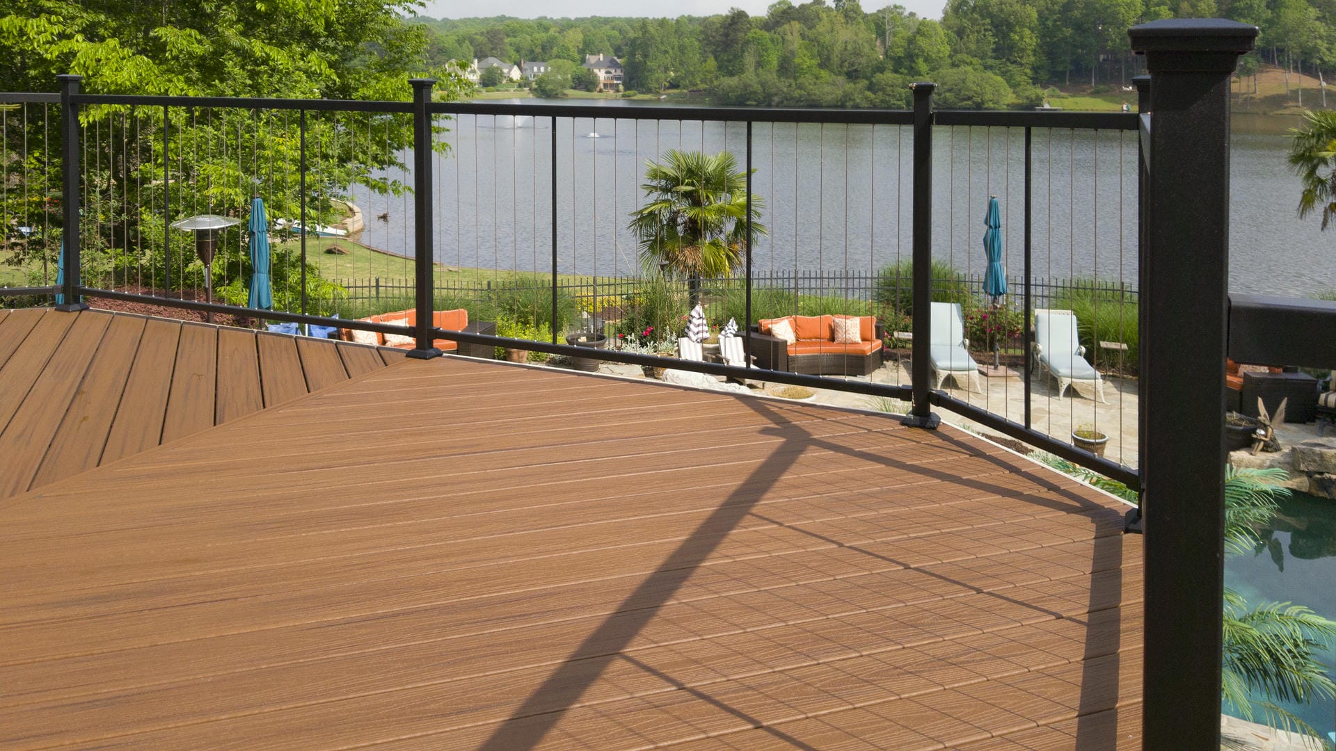 Stainless steel cable deck railing keeping the lake view clear from a composite deck
