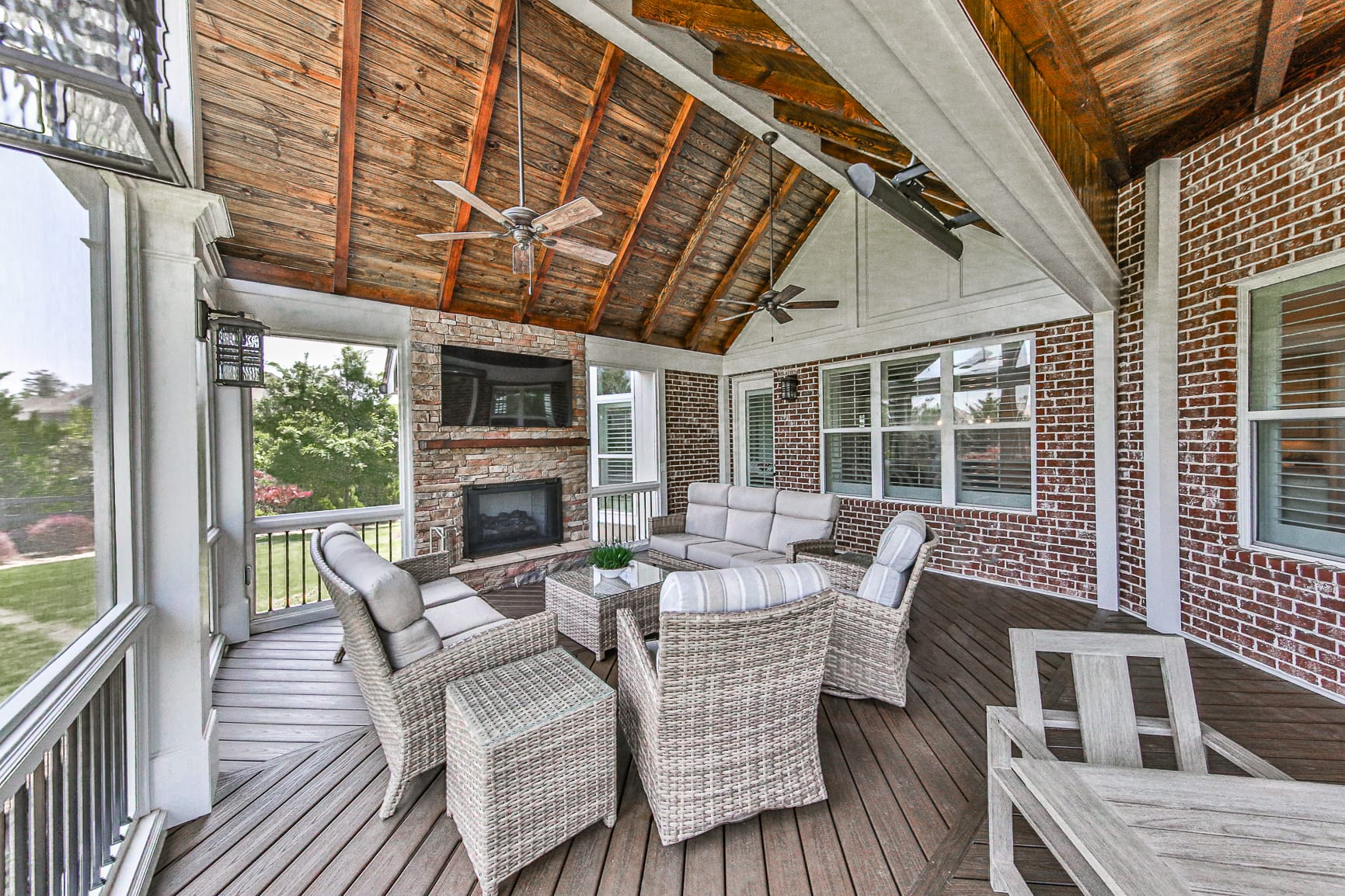Exposed cedar rafters running the length of a covered porch