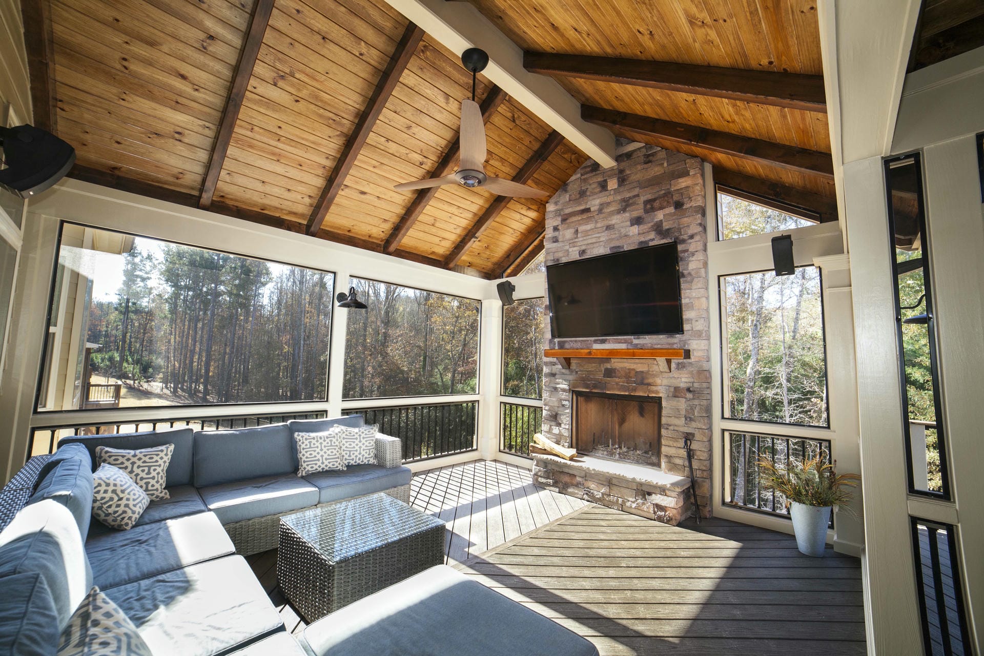 Stained cedar rafter ceiling on a custom porch interior