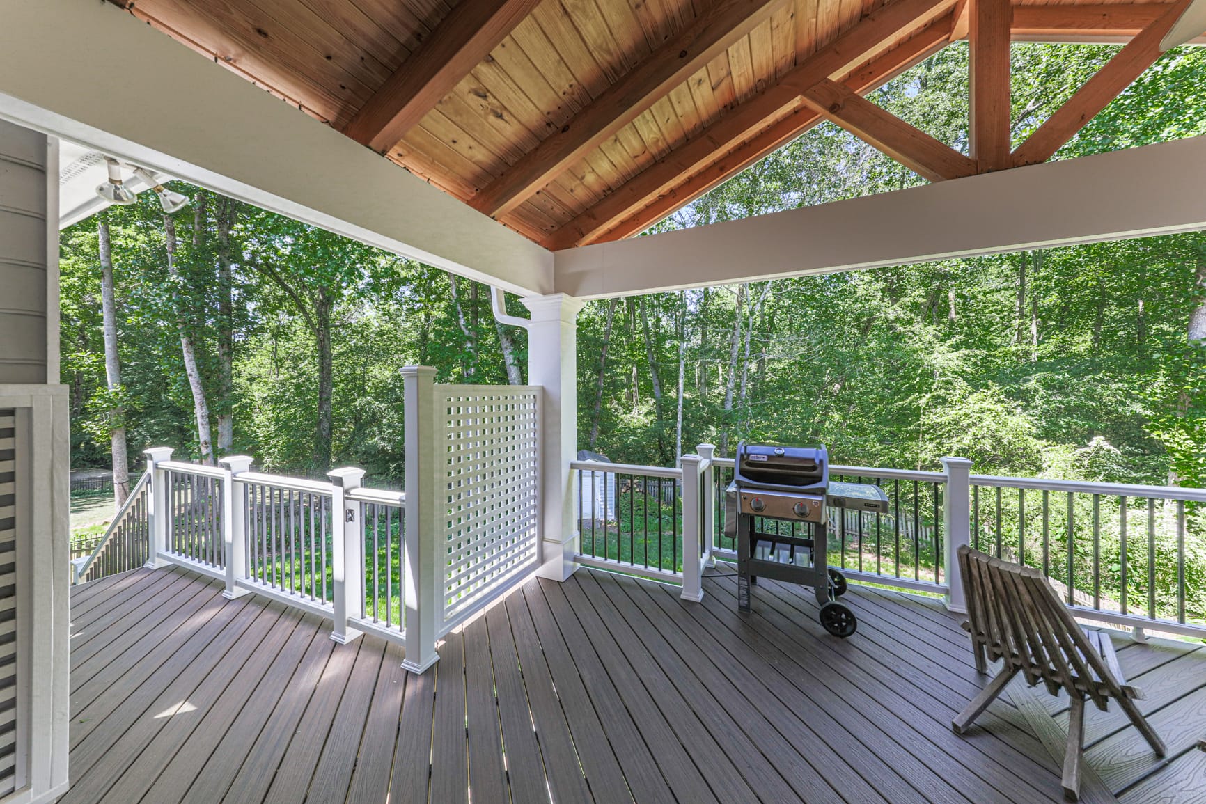 Cedar rafter ceiling over a furnished outdoor living space