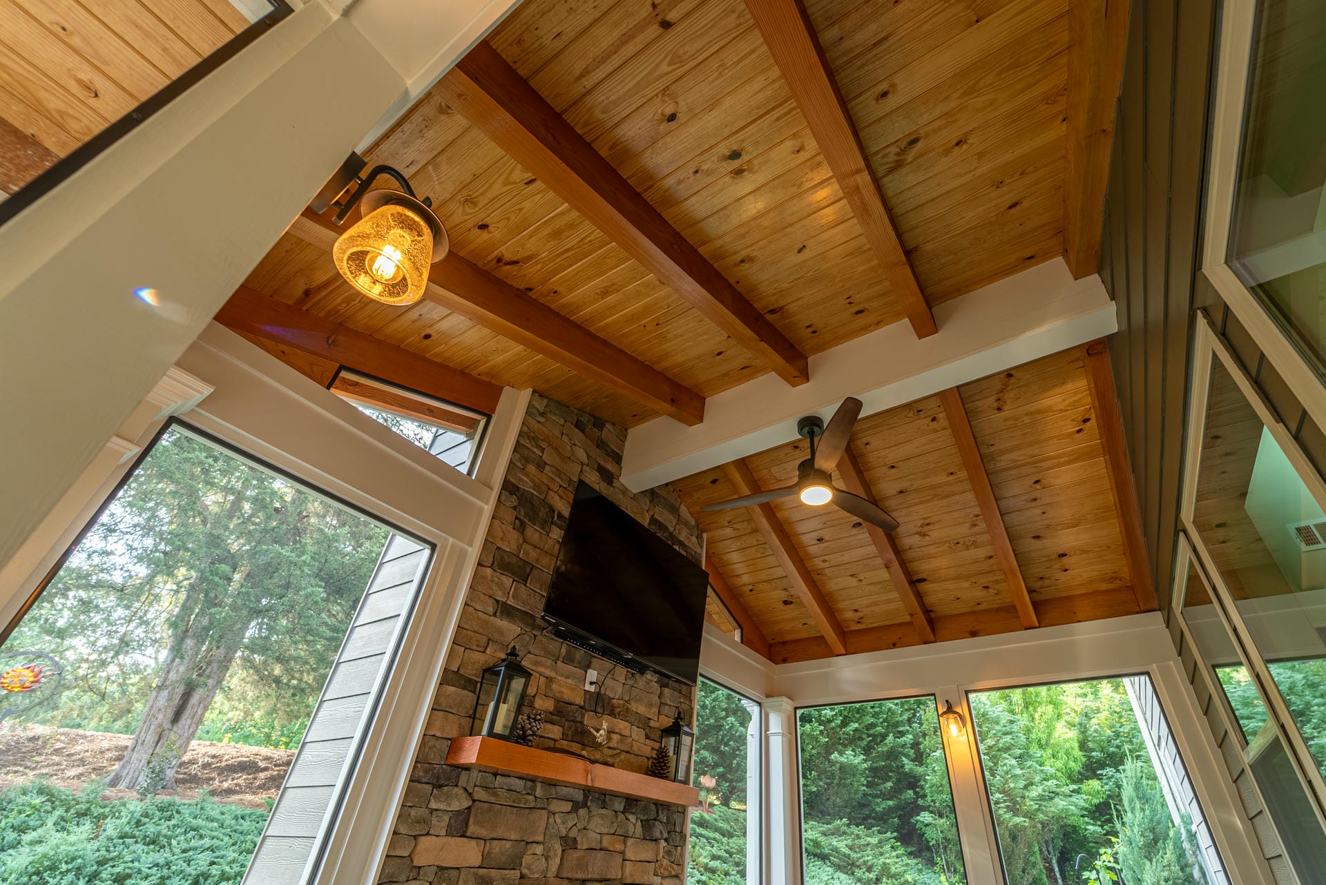 Cedar tongue and groove ceiling detail above a covered porch