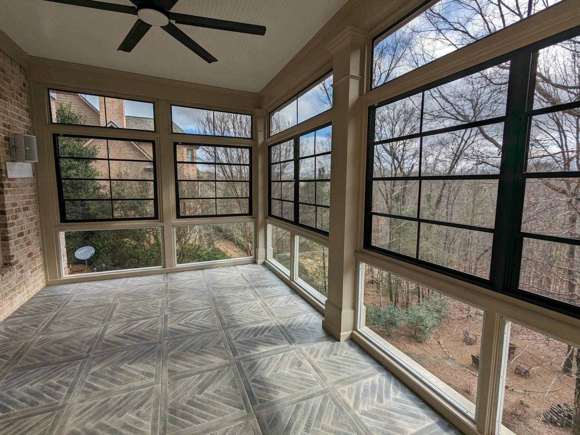 Porch enclosure with EZE-Breeze windows and an exposed rafter ceiling