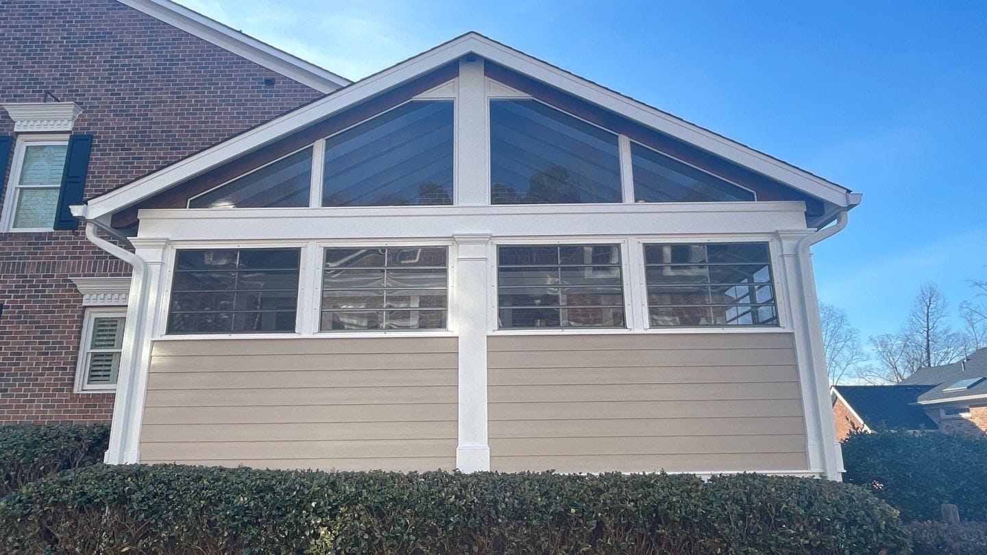 EZE-Breeze porch windows framing a wooded backyard view