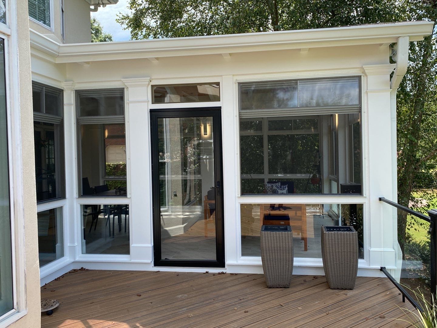Interior of a porch combining EZE-Breeze windows with tempered glass