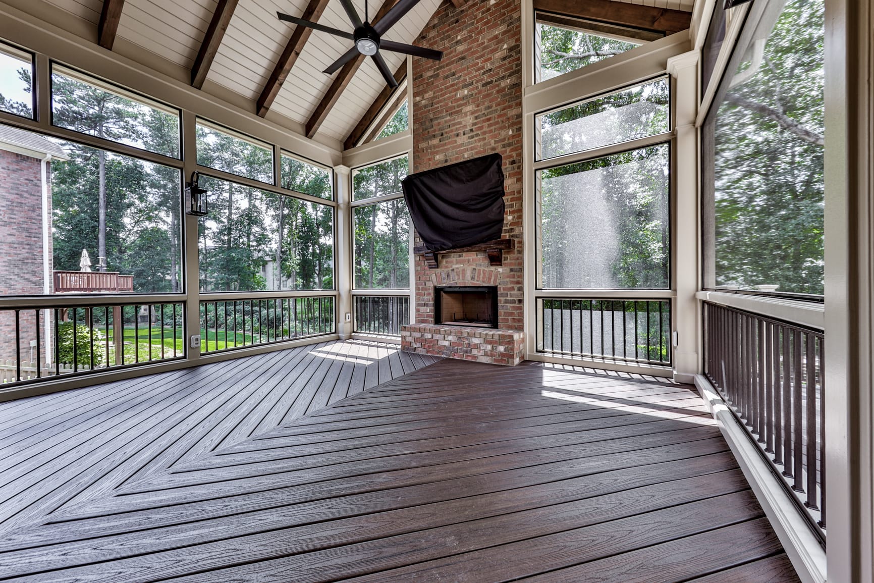 Outdoor living room built around a porch fireplace