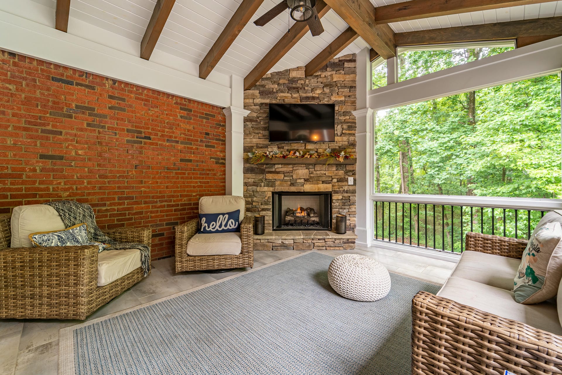 Screened porch with fireplace and tongue and groove ceiling