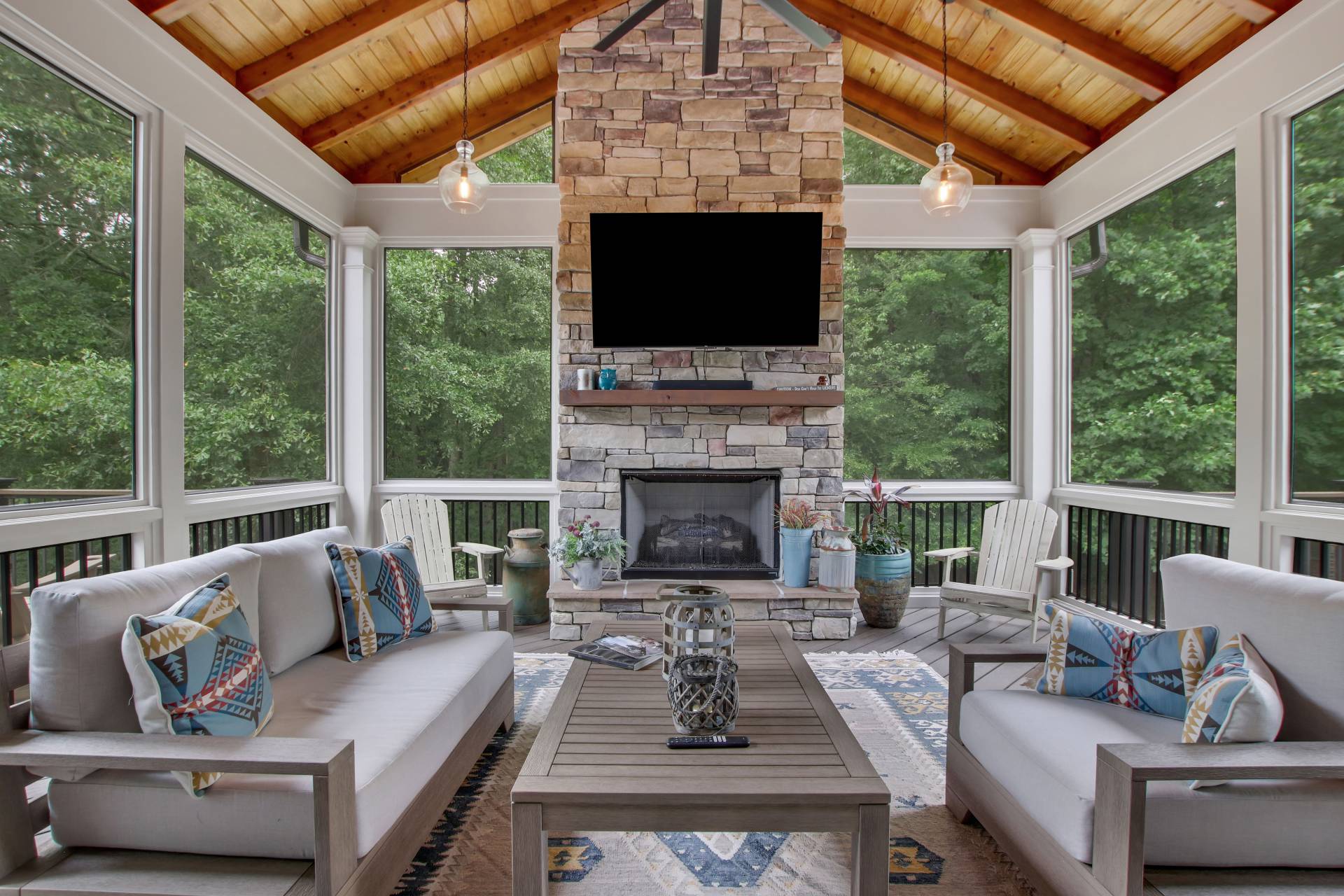 Stone fireplace built into a custom outdoor living space