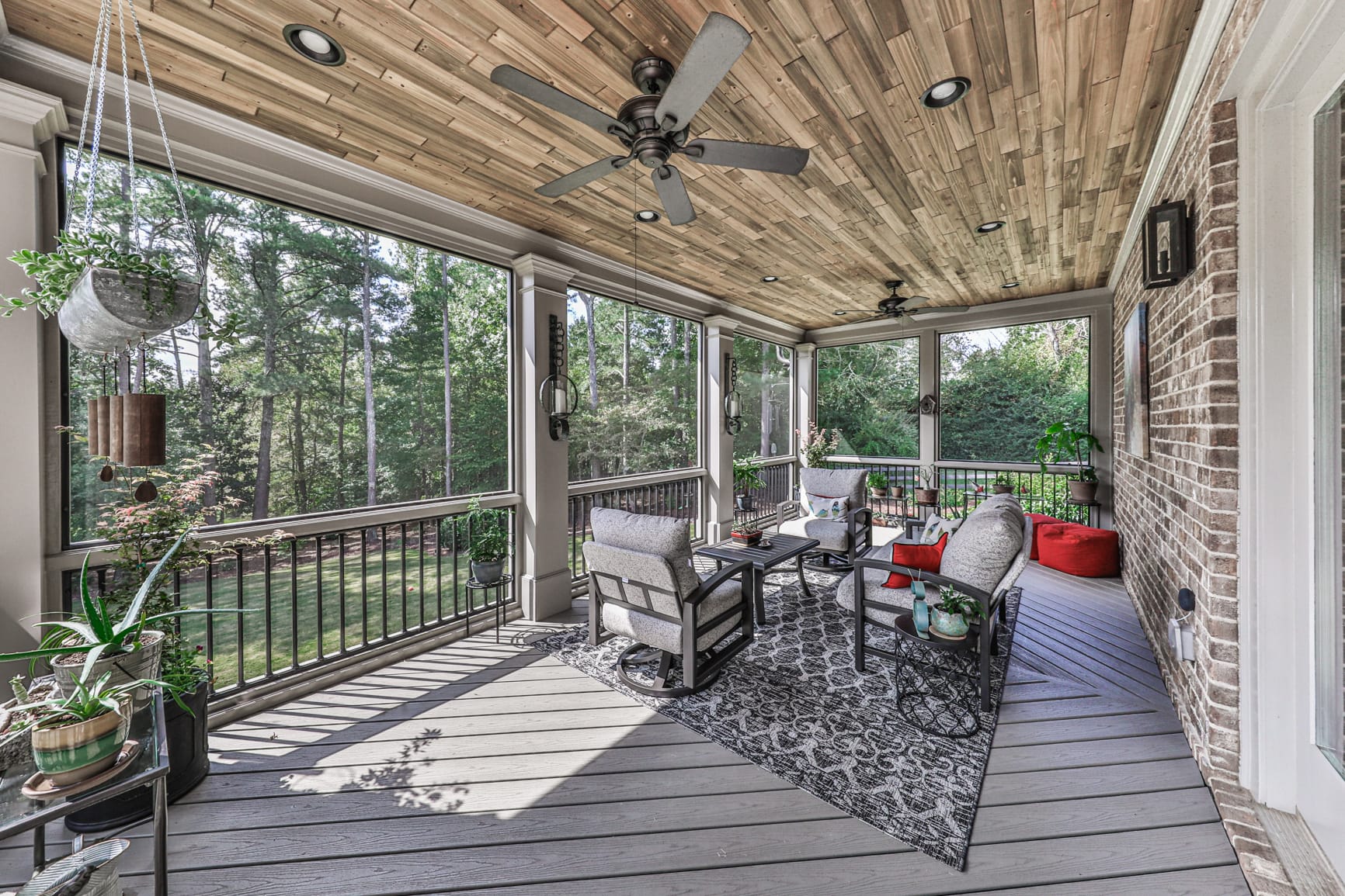 Tongue and groove porch ceiling running the length of the room