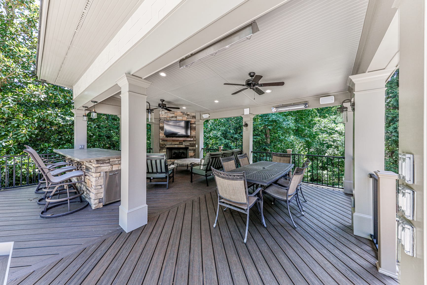 Outdoor living space finished with a wood tongue and groove ceiling