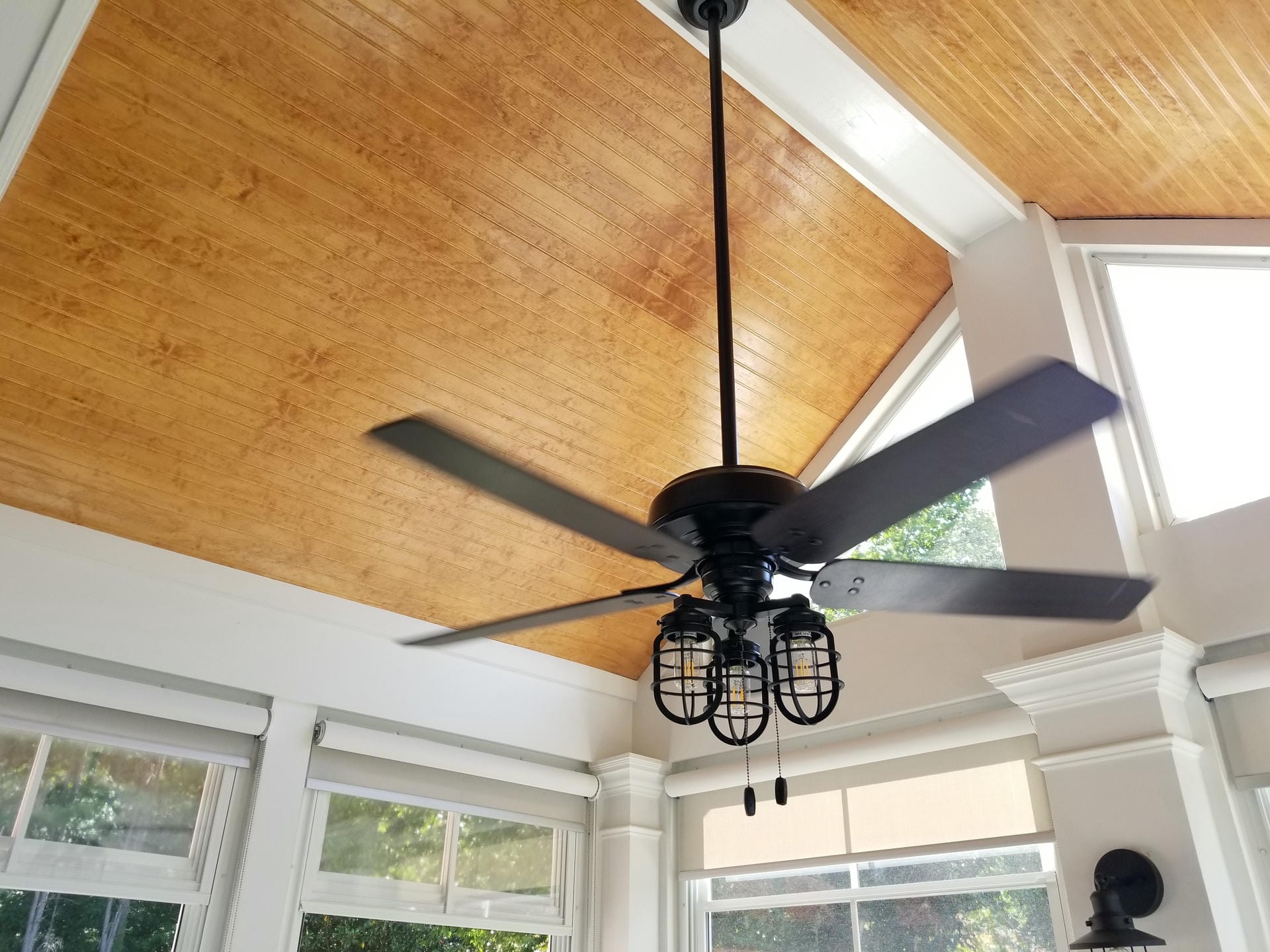 Stained tongue and groove porch ceiling matched to the home's trim