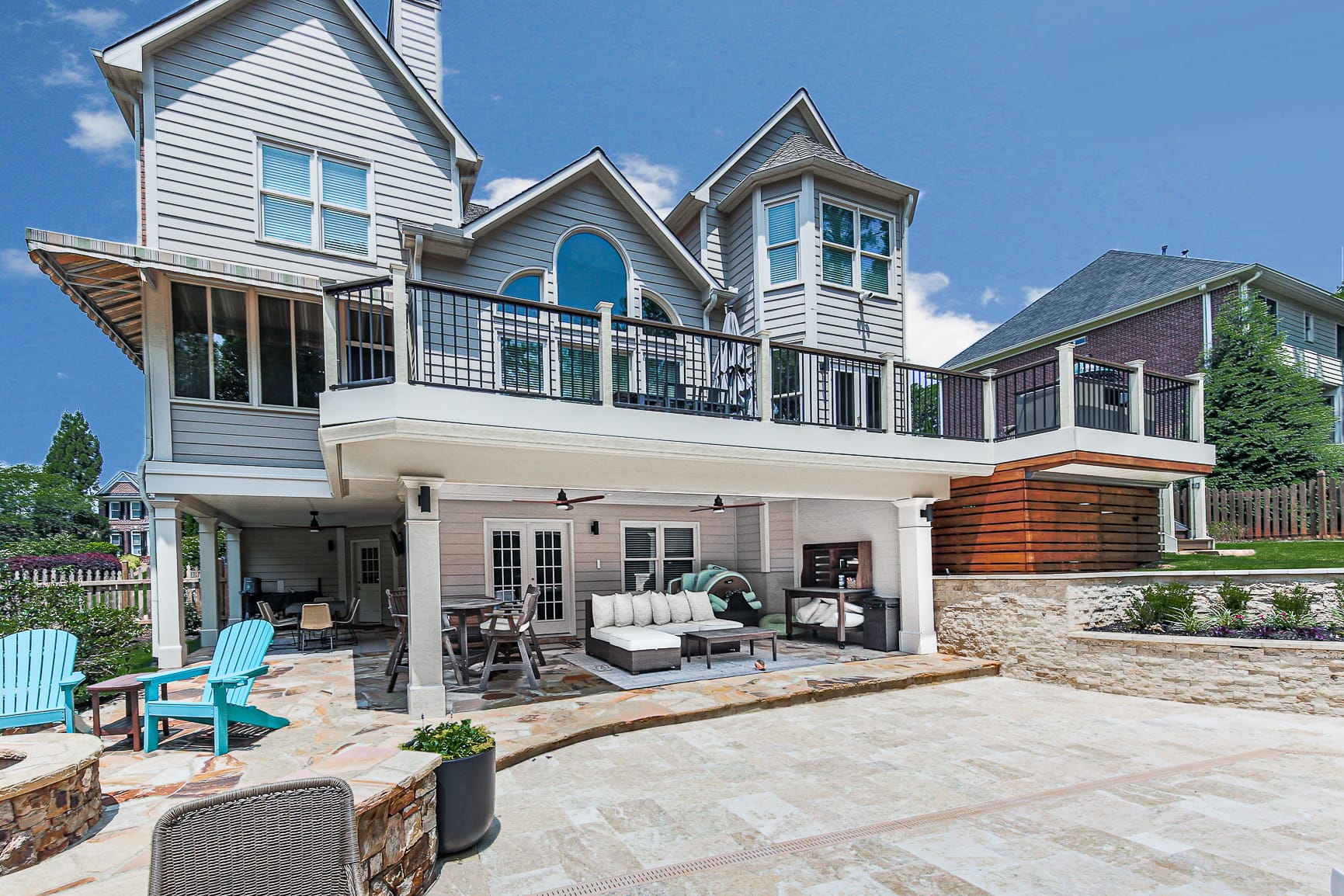 Rear elevation of a home with a dry finished living space under the upper deck